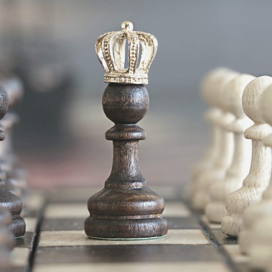 content strategist: chess pawn with a crown on it's head