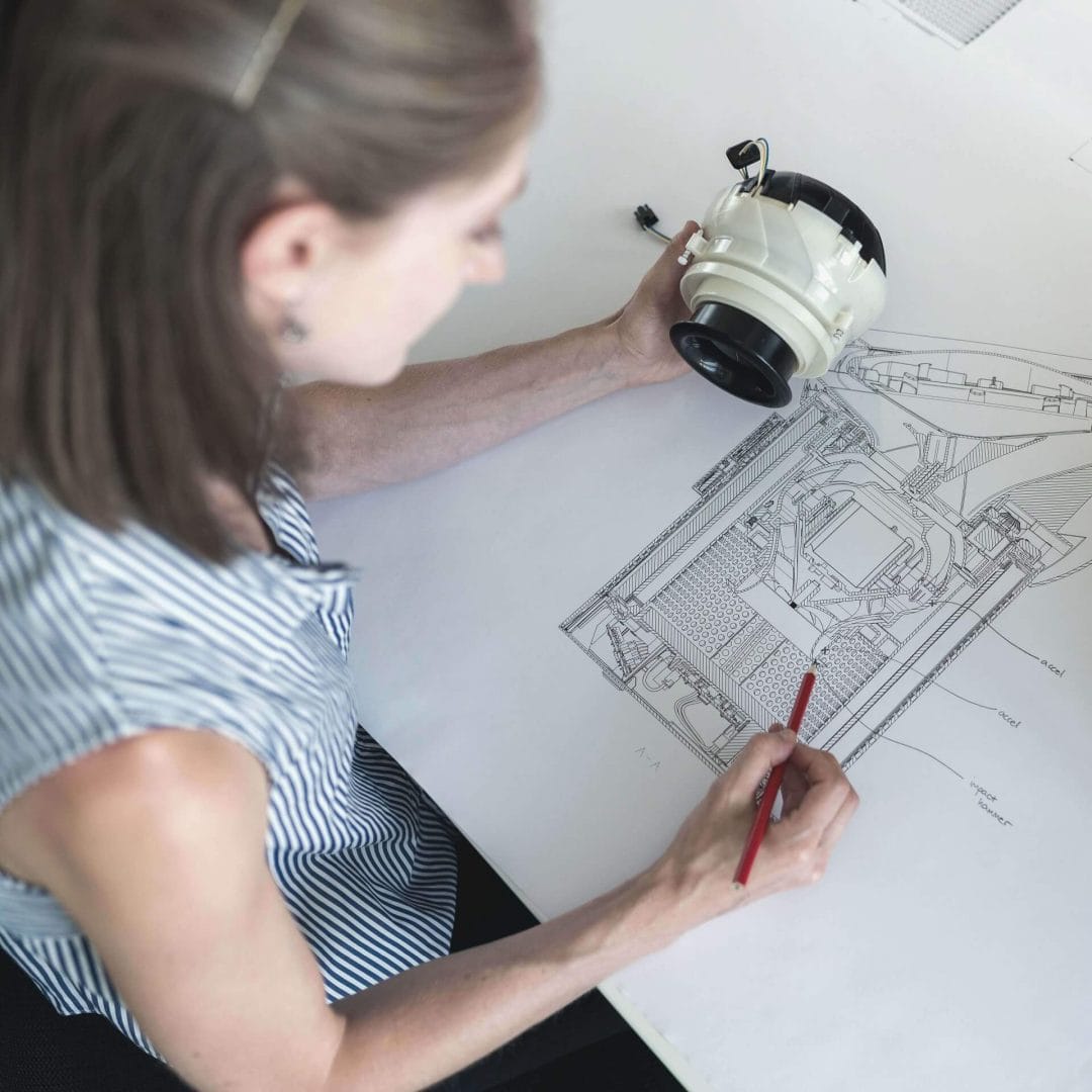 Brand Building: Business woman looking over blueprints