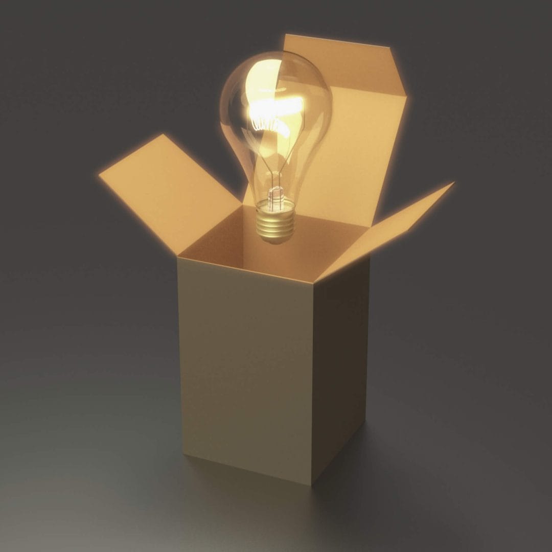 12 Creative Out of the Box Web Design Ideas: Light bulb outside of a cardboard box.