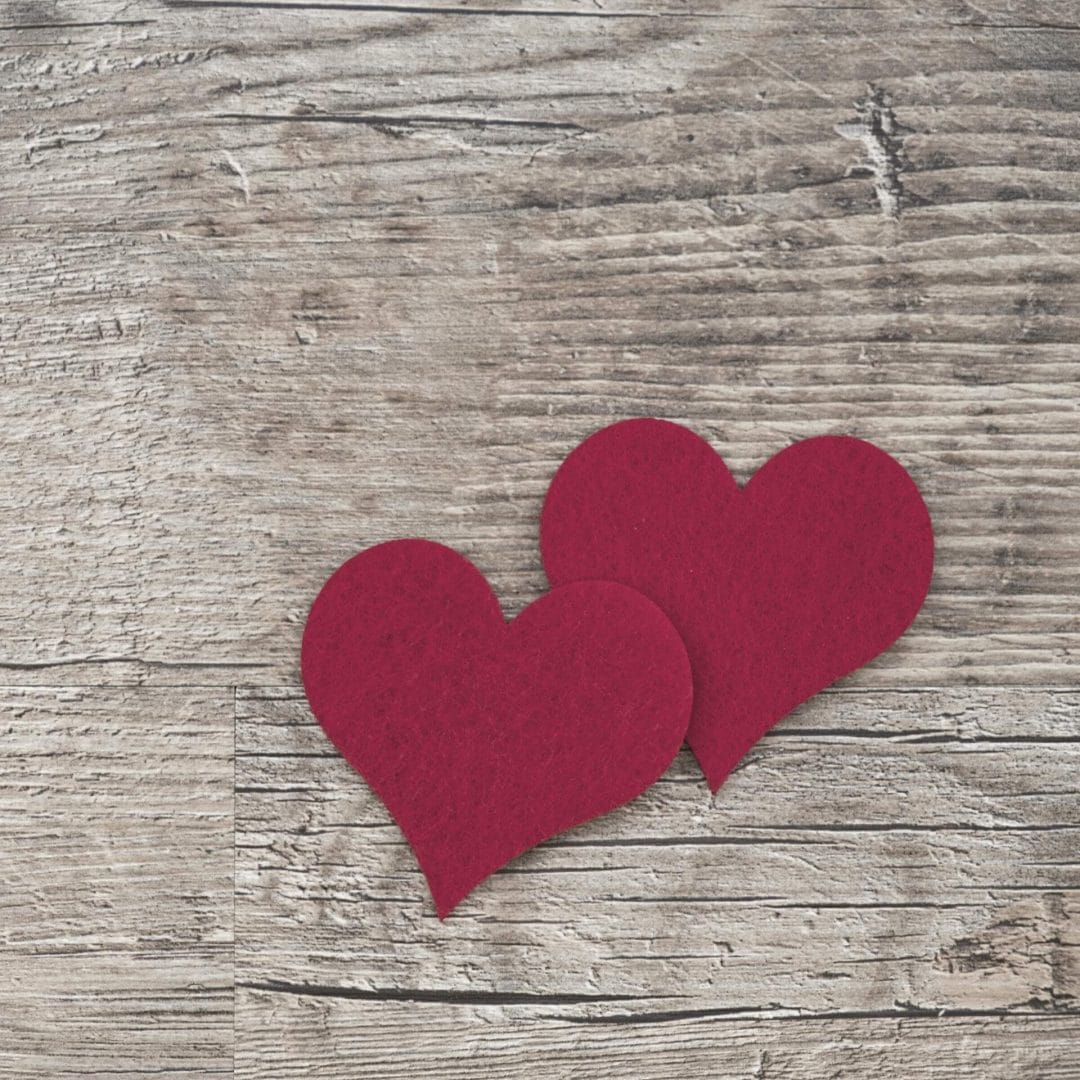 Donor Retention: Felt hearts on a wood table